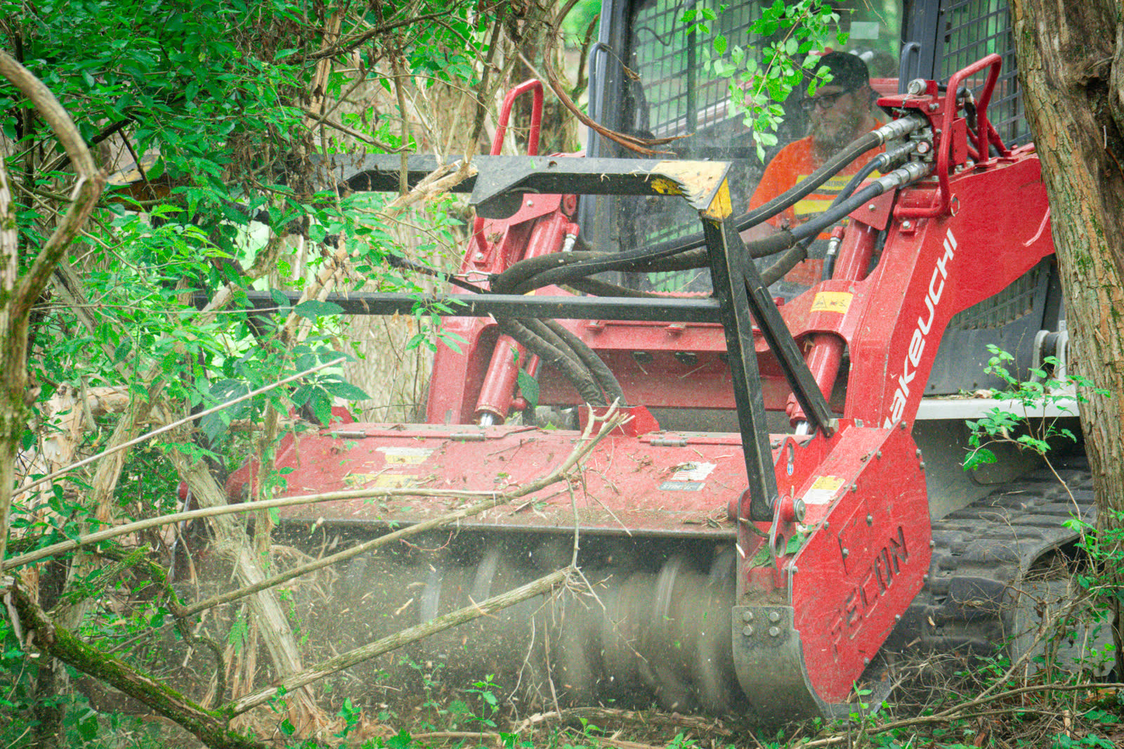 Brushworks forestry mulching equipment processing saplings, vines, and invasive brush near Cincinnati